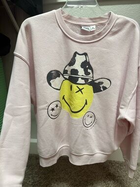 Juniors Smiley World Light Pink Smiley Face Graphic Sweatshirt